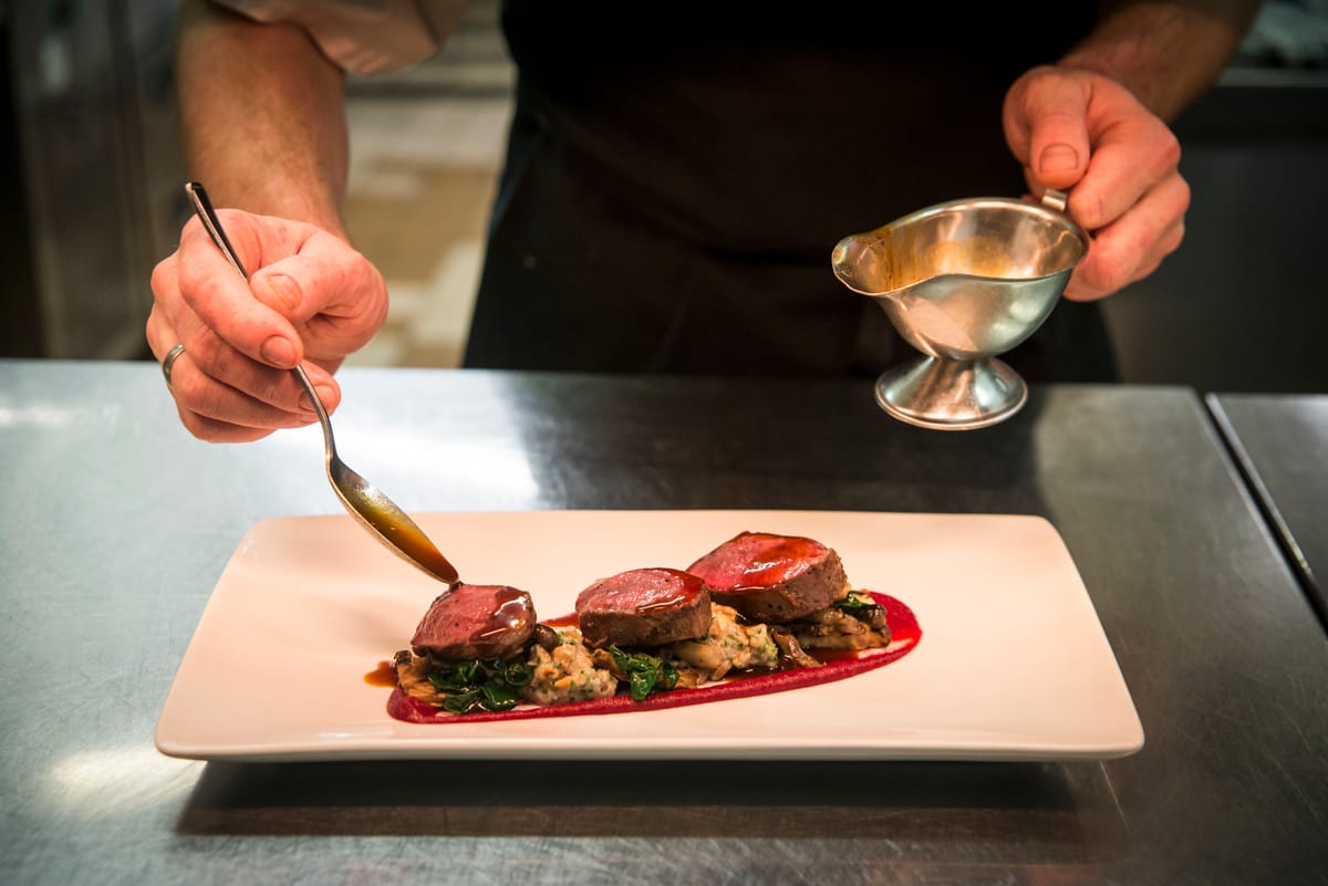 Plating up steak at the Ubiquitous Chip restaurant