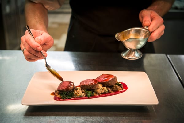 Plating up steak at the Ubiquitous Chip restaurant